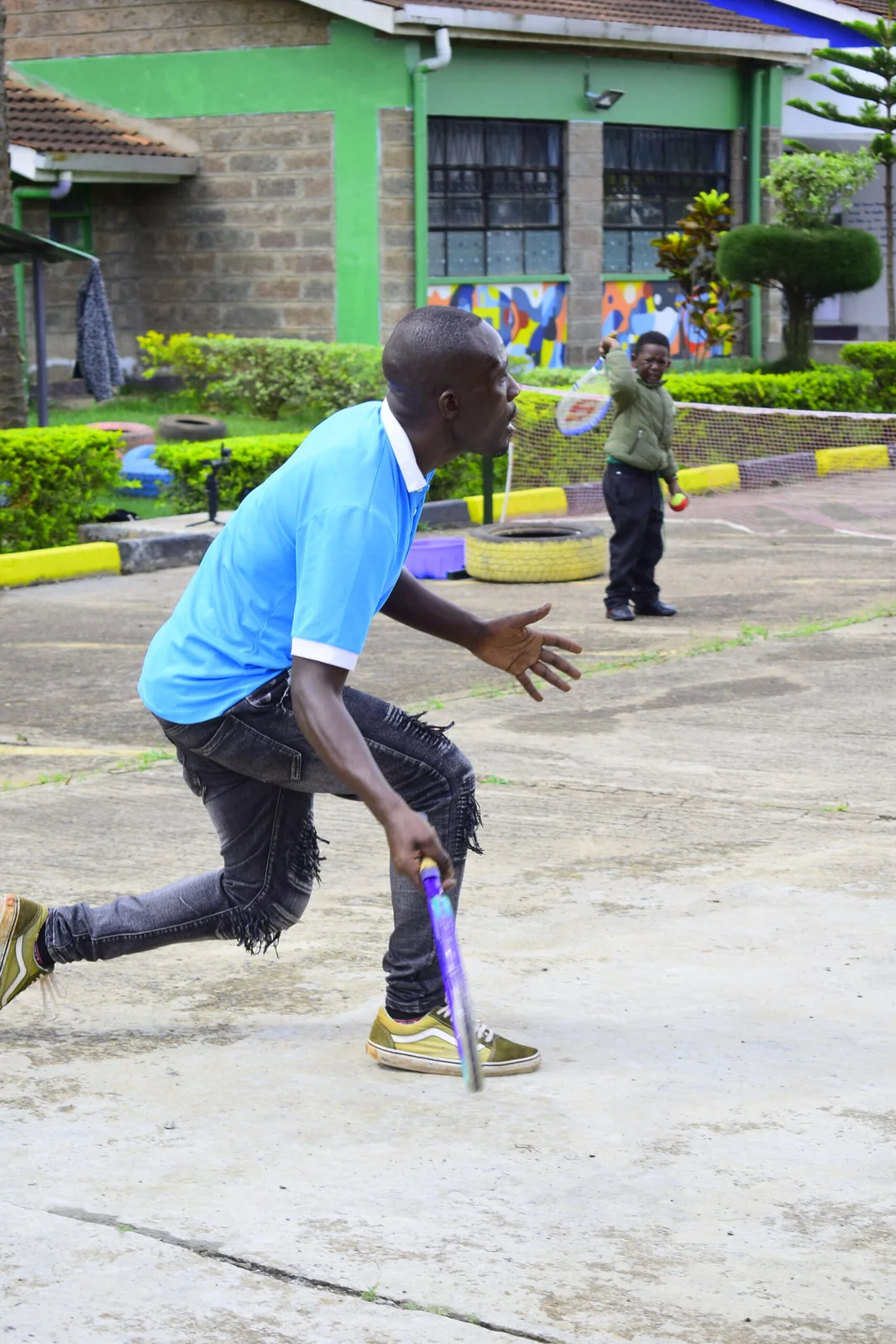 Tennis Coach Demonstrating Forehand Stroke on Court